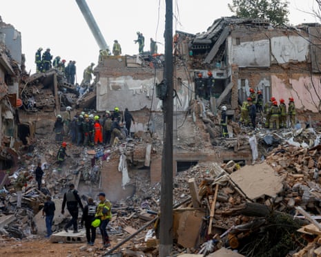 Emergency services work to rescue residents from under the debris at the site of an apartment building which was hit by a Russian missile strike in the town of Pryluky in the Chernihiv region, Ukraine.
