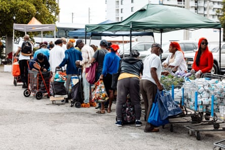 People in line getting food