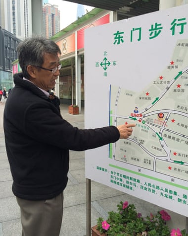 Leo Houng inspects a map of Shenzhen