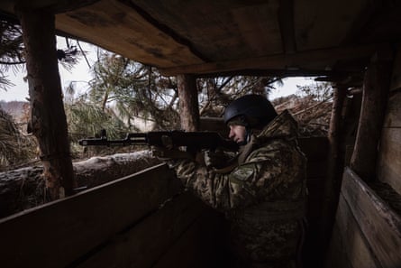 A soldier oversees the Russian positions.