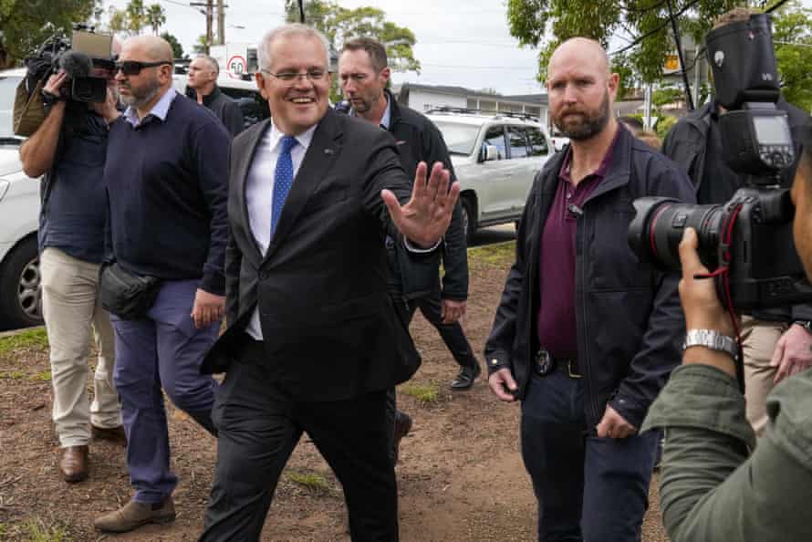 Scott Morrison gestures after voting in his electorate of Cook in Sydney
