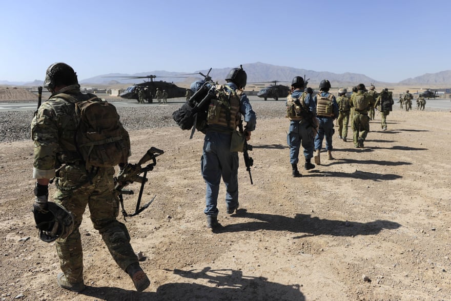 Afghan officers from the Provincial Police Response Company and Australian soldiers during an operation in Kandahar province