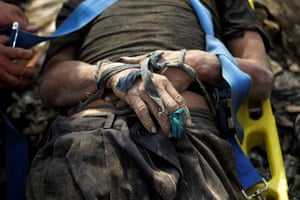 Guatemala City, Guatemala: The body of a rubbish collector who was killed in a landslide