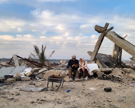 Malak Tantesh and her father, Amjed Tantesh, in the ruins of their home in Beit Lahia, northern Gaza.