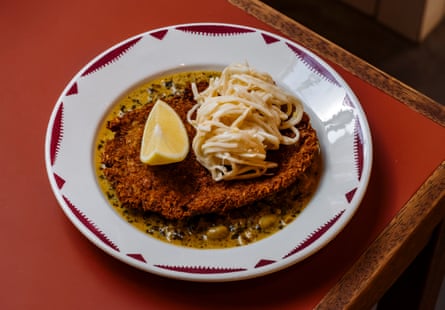 Tempeh and smoked tofu schnitzel with celeriac remoulade and Cafe de Paris butter at the Holy Carrot, Spitalfields, London. For Grace Dent review in Feast, 18th April 2025