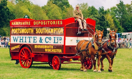 Heavy horses pulling a wagon in a competition at Romsey Show in Hampshire