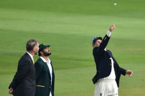 Pakistan’s Azhar Ali looks on as England’s Joe Root tosses the coin.