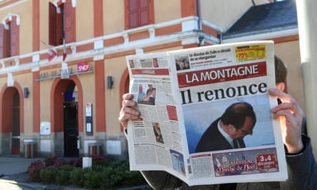 A man reads La Montagne in Tulle.