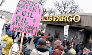 Dakota access pipeline protesters demonstrate outside a Wells Fargo bank branch in Bismarck, North Dakota