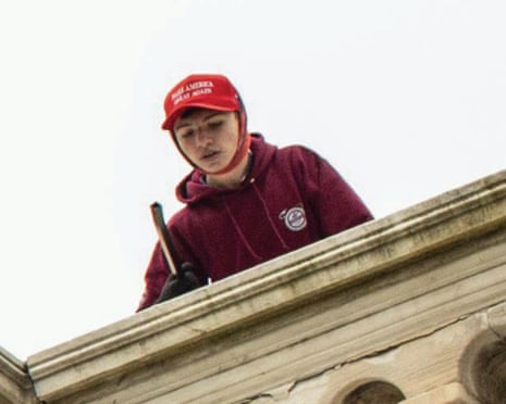 a teenager in a red hat