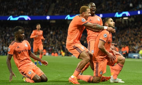 The Lyon players rush to celebrate Lyon’s decisive second goal against Manchester City with the scorer Nabil Fekir, who almost joined Liverpool in the summer.