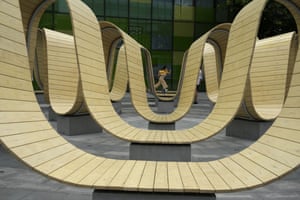 Beijing, China. A child runs through an art installation at a mall