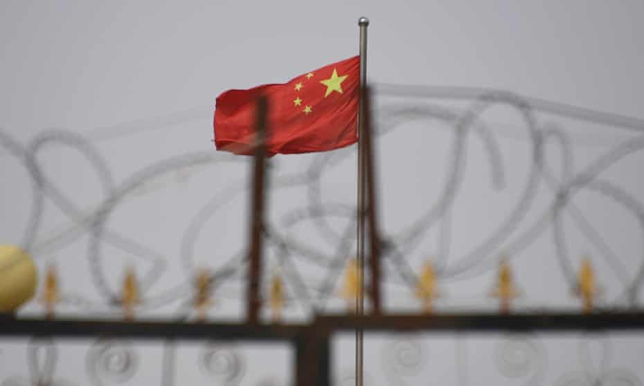 Chinese flag and barbed wire