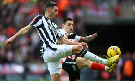 Newcastle United's Fabian Schar high kicks with Sunderland's Nazariy Rusyn.