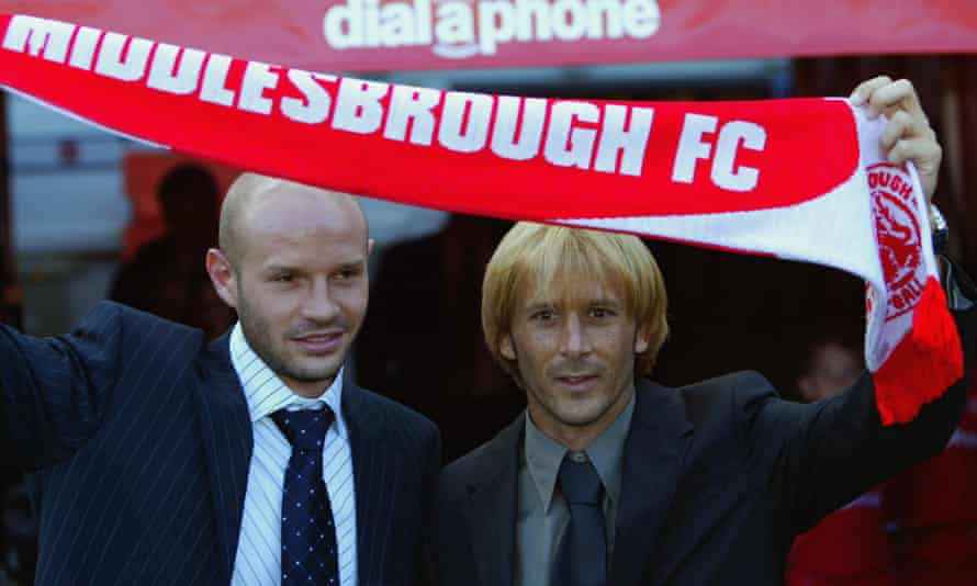 Middlesbrough’s new signings Danny Mills and Gaizka Mendieta hold up a scarf in August 2003.