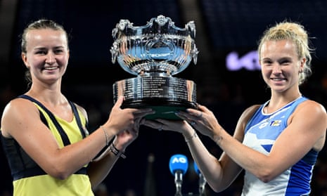 Czech Republic's Barbora Krejcikova (left) and Katerina Siniakova lift the winners’ trophy after defeating Japan's Shuko Aoyama and Ena Shibahara in the women's doubles final match