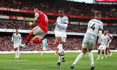 Arsenal's Gabriel Martinelli (second left) jumps to take evasive action