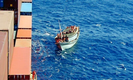 Indonesian ferry carrying 438 asylum seekers pulling along side the Norwegian cargo ship MS Tampa on 26 August, 2001.
