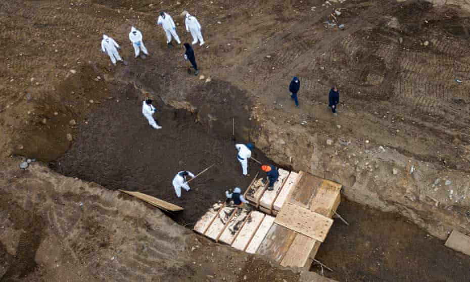 Drone pictures show bodies being buried on New York’s Hart Island amid a surge burials during the Covid-19 outbreak on 9 April.