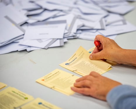 Voting envelopes are opened as the counting of votes takes place in Sweden.