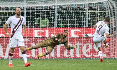 Milan goalkeeper Gianluigi Donnarumma saves Andrea Belotti’s injury-time penalty.