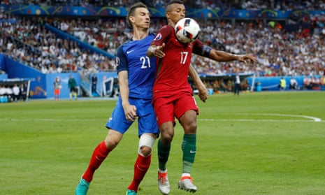 Laurent Koscielny challenges Portugal’s Nani in the Euro 2016 final