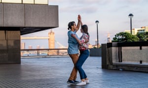 Luis Alberto and Marta practice their salsa dancing on an office walk way near London Bridge