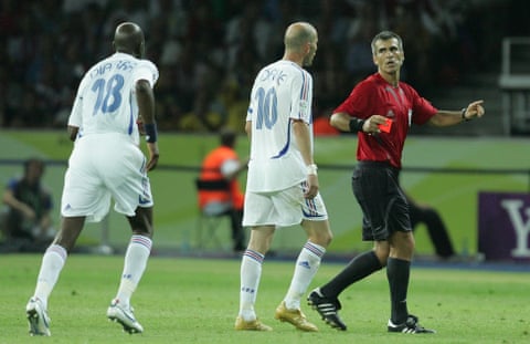 Zinedine Zidane talks to the referee Horazio Elizondo after being sent off in the 2006 World Cup final, as Alou Diarra approaches