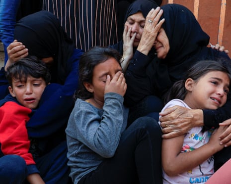 Palestinians at Nasser hospital in Khan Younis mourn for those killed by Israeli attacks.
