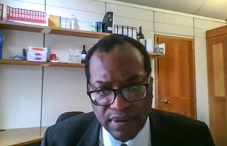 Screengrab of Kwasi Kwarteng, wearing glasses, in an office