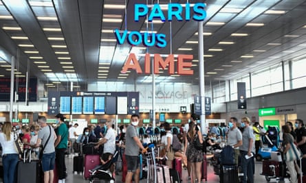 Travellers, wearing protective face masks, at Orly airport, France, on 1 August, 2020.