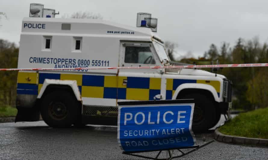 A police vehicle blocks a road during a security operation close to Dungiven in County Derry.