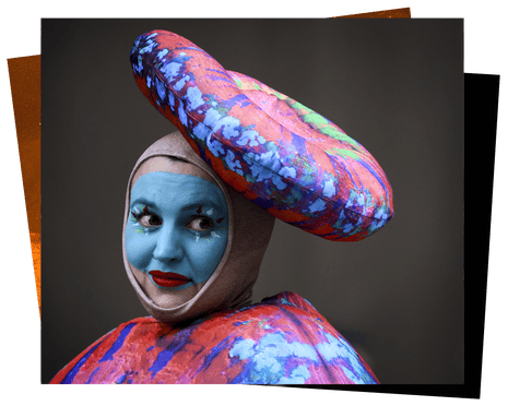 A performer wears a coral-inspired costume.