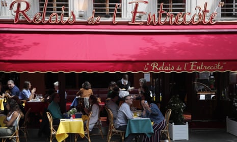 Customers take a selfie as they enjoy a lunch at a restaurant, in Paris, Monday, 15 June, 2020.