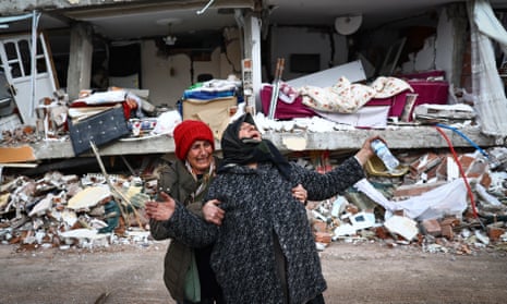 Two women at the site of a collapsed building in the Elbistan district of Kahramanmaraş