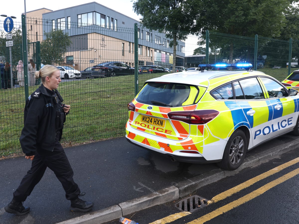 Girl arrested after two students and staff member stabbed at Manchester school | UK news | The Guardian