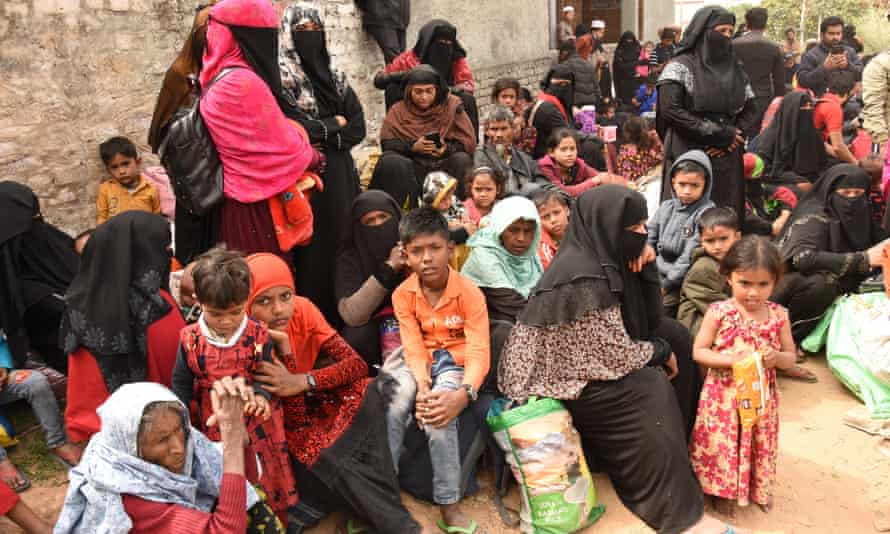 Rohingya Muslims along with their luggage outside a mosque in Jammu, in Kashmir, India, on 7 March.