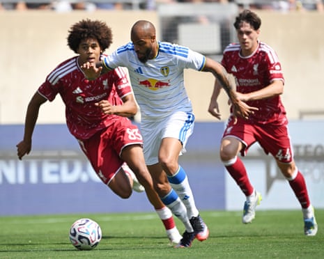 Liverpool’s Ifeanyi Ndukwe and Lukas Nmecha of Leeds tussle for possession.