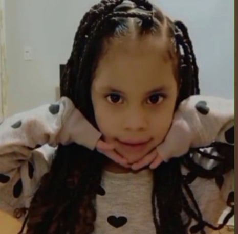 Eddimar Hernandez Chacon, a young girl with braided hair, rests her chin on her hands