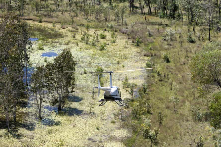 Rangers travelling by helicopter to to a remote site in the south of the Warddeken IPA.