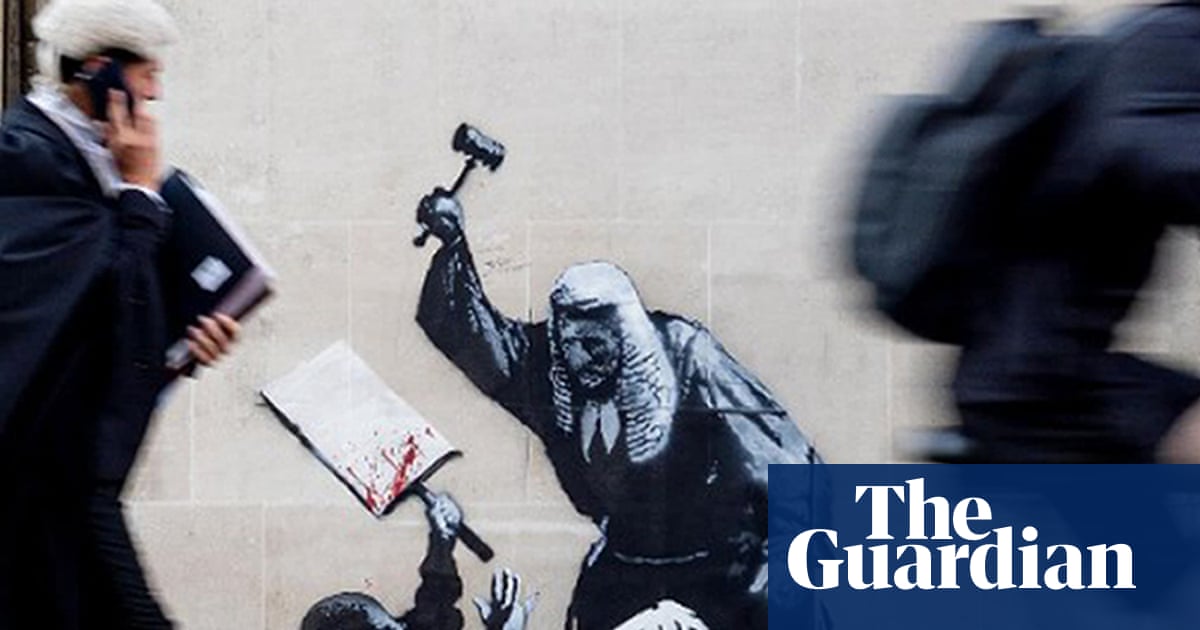 Court staff cover up Banksy image of judge beating a protester