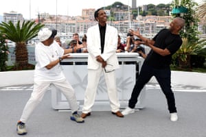 US director and executive producer Spike Lee, actor and singer Asap Rocky in white Miu Miu suit and actor Denzel Washington at a photocall for the film Highest 2 Lowest on 19 May