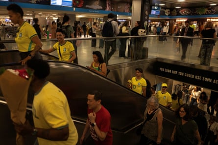World Cup fans ride an escalator in Penn Station on 12 June.