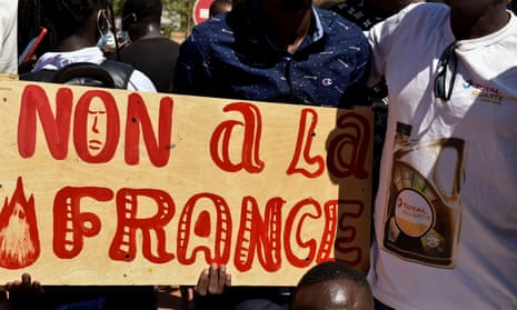 Demonstrators in Burkina Faso hold a placard that reads ‘No to France’