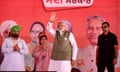 Narendra Modi (centre), India's Prime Minister and leader of the ruling Bharatiya Janata Party (BJP) gestures to his supporters during an election campaign rally in Gurdaspur on May 24, 2024, amid the country's ongoing general election.