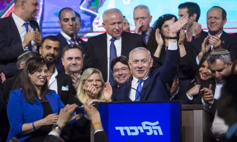 Benjamin Netanyahu, his wife, Sara and Likud party members greet supporters during Likud’s party as the country waits to hear election results.