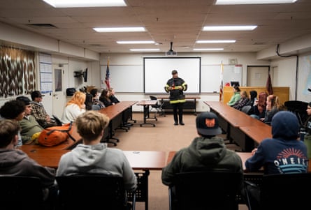 a man in front of a classroom