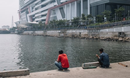 Men fishing at the back side of Green Bay Mall of North Jakarta.