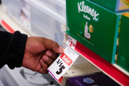 a person holding a price tag