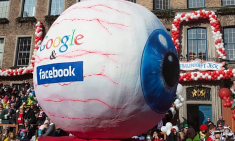 Here’s looking at you: a float in a German carnival parade depicts surveillance by Google and Facebook. 